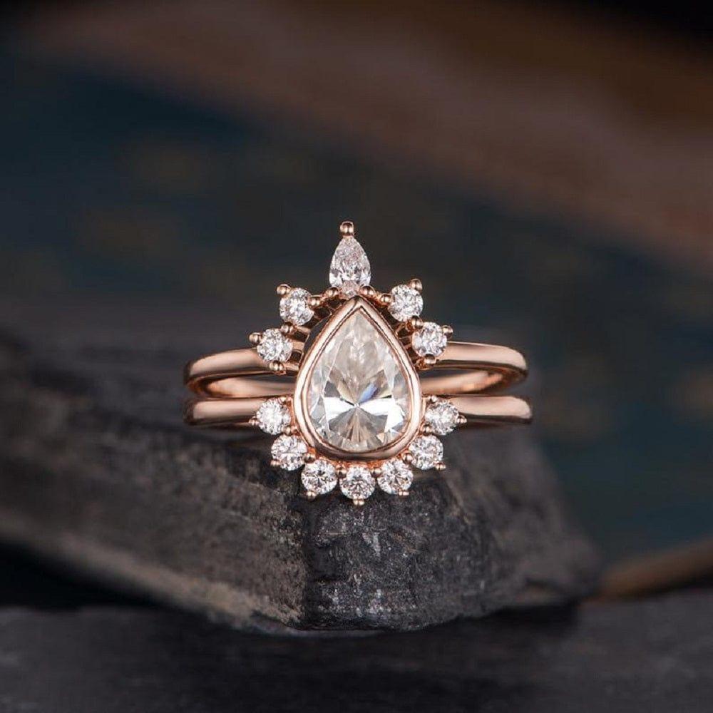 Pear Cut Rose Gold Curved Shaped Crown Moissanite
