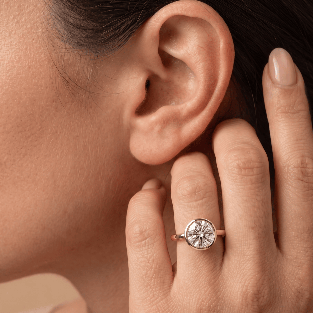 10K round diamond ring on hand lifestyle shot