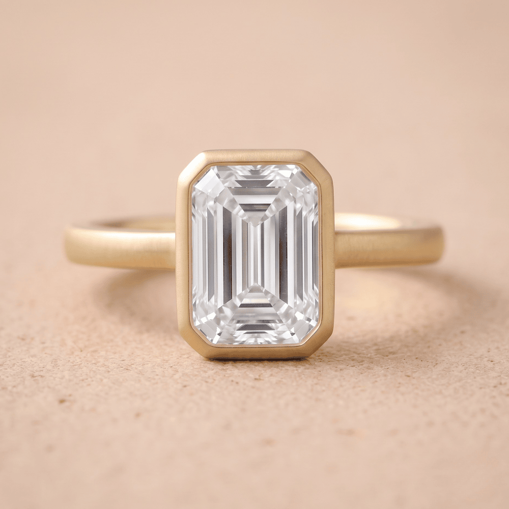 14K emerald bezel set solitaire ring with brilliant sparkle