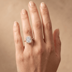 Emerald halo ring with pavé accented band