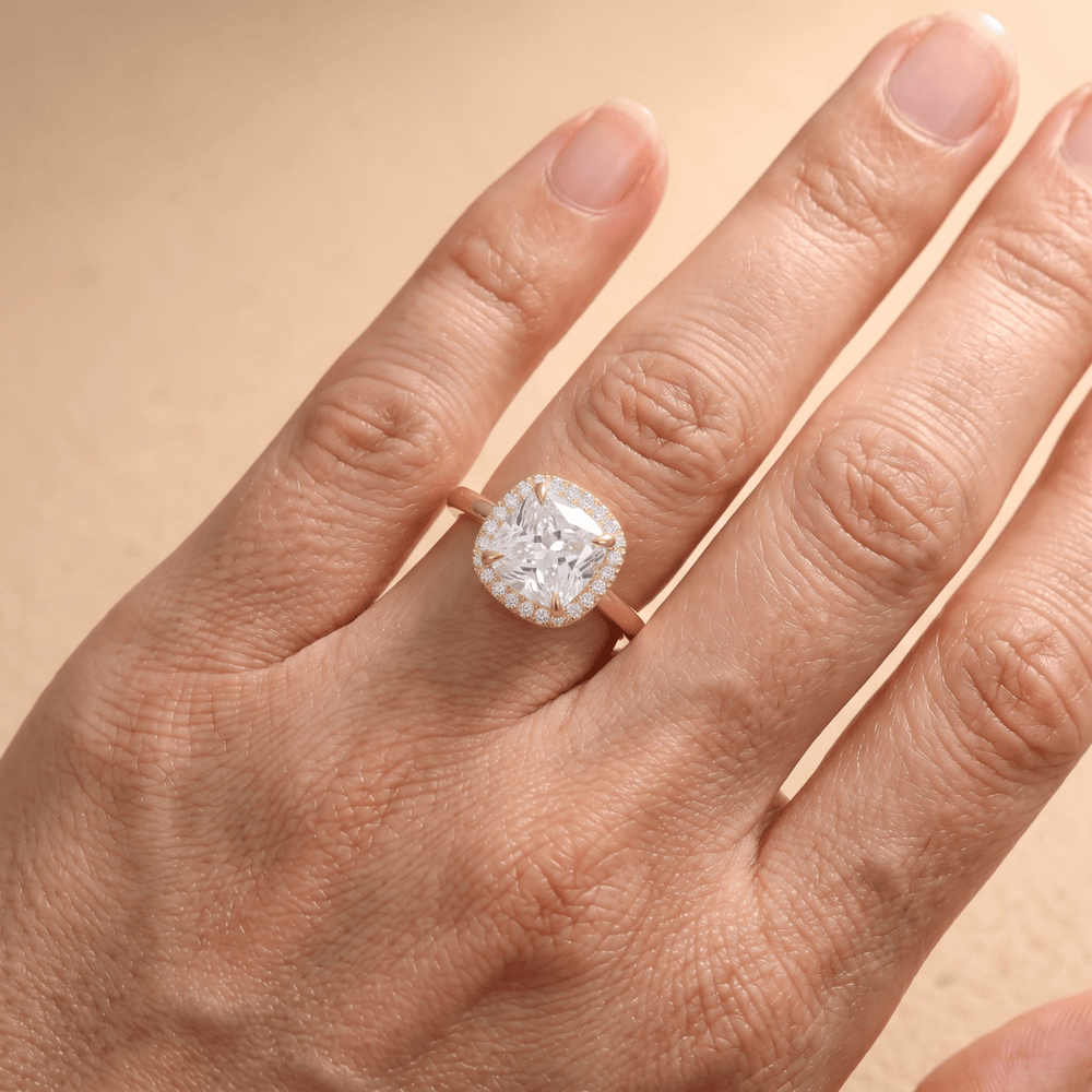 Cushion cut moissanite diamond ring on hand