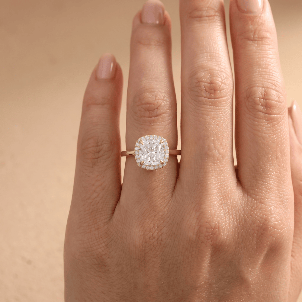 Cushion cut moissanite diamond ring on hand