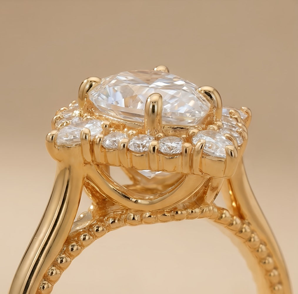 Gold filigree band pear diamond halo ring