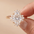 Oval halo engagement ring worn on hand