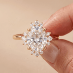 Oval halo engagement ring worn on hand