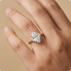 Oval halo engagement ring worn on hand