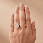 Oval halo engagement ring worn on hand Finger