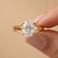 Split shank oval diamond ring in 14K gold on hand