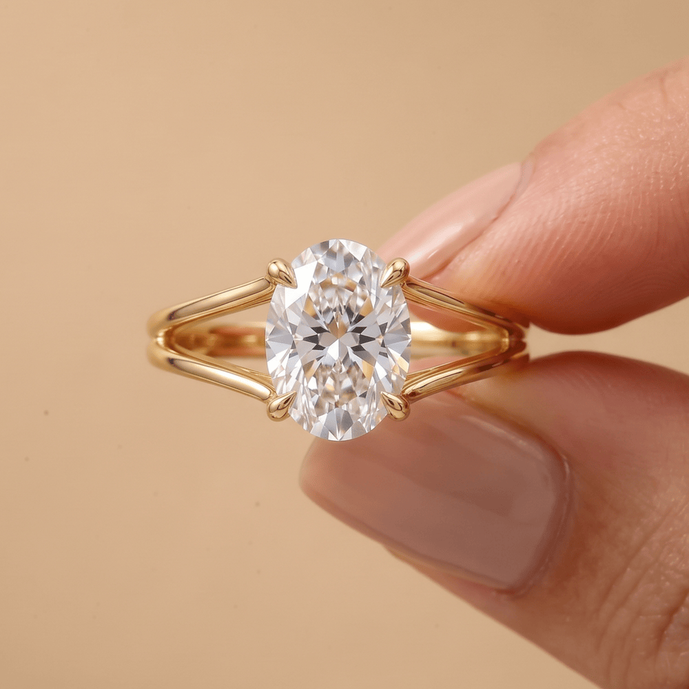 Split shank oval diamond ring in 14K gold on hand