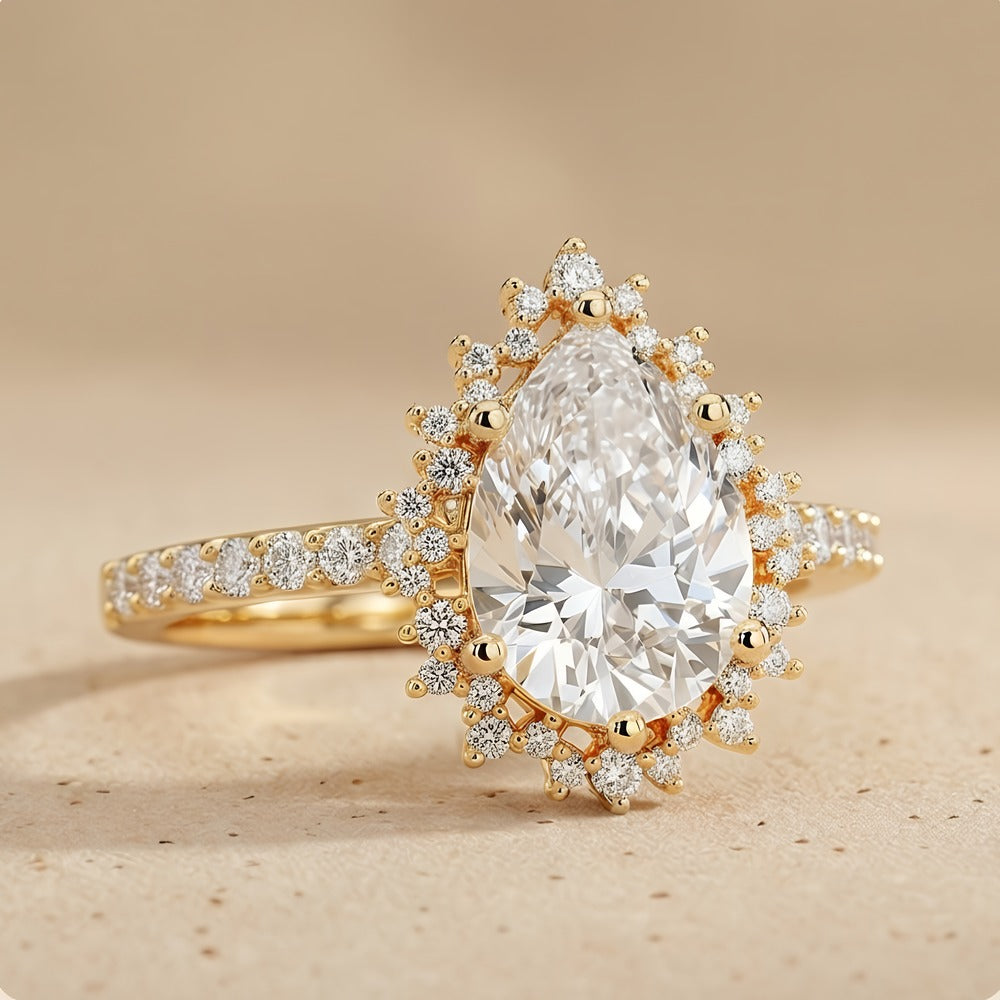 Pear-shaped lab-grown diamond with halo setting close-up