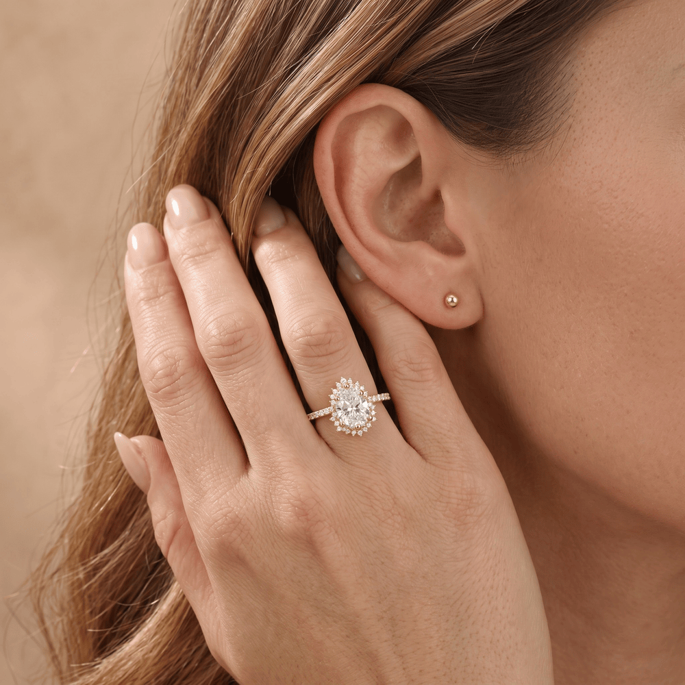 Lab diamond pear ring with sunburst halo pattern