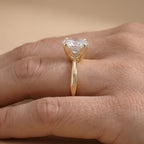 Side view of pear lab grown diamond solitaire in 14K gold band