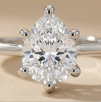 Ethically sourced pear diamond solitaire ring in 14K gold