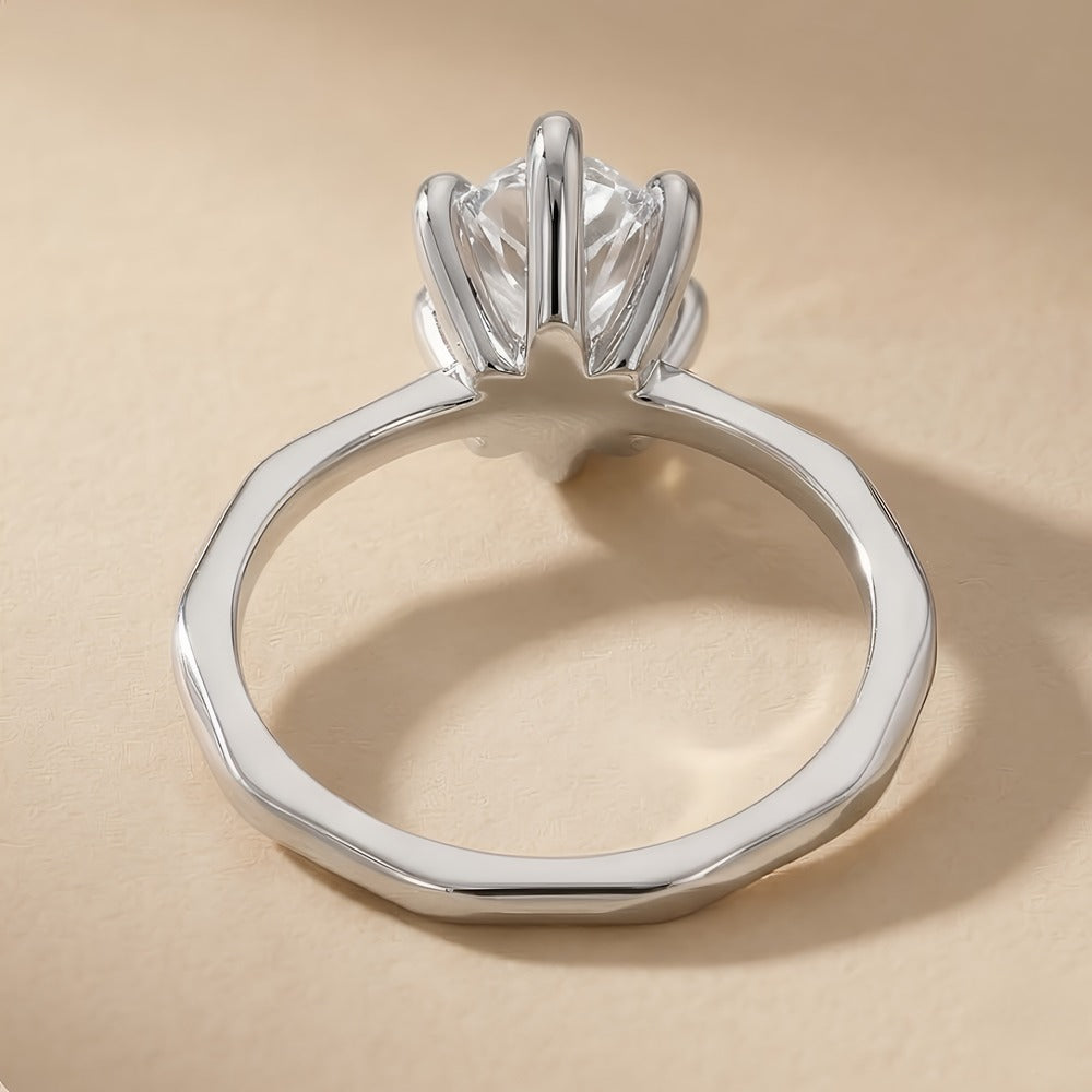 Top view of pear shaped lab grown diamond on 14K White gold band