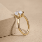 Side view of pear lab grown diamond solitaire in 14K gold band