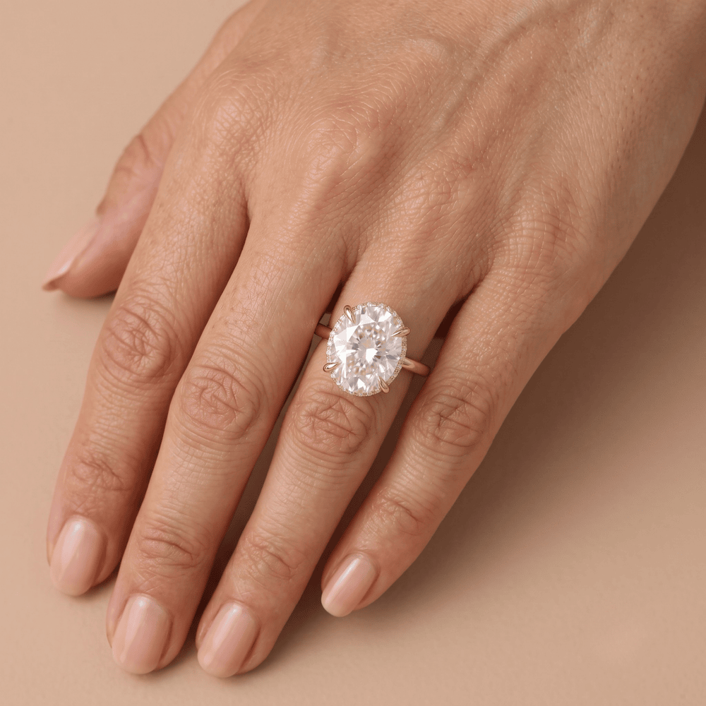 Oval cut diamond dual halo ring hand model wearing