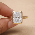 Radiant cut diamond ring worn on hand in 14K gold