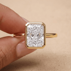 Radiant cut diamond ring worn on hand in 14K gold