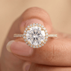Round diamond halo ring on model hand