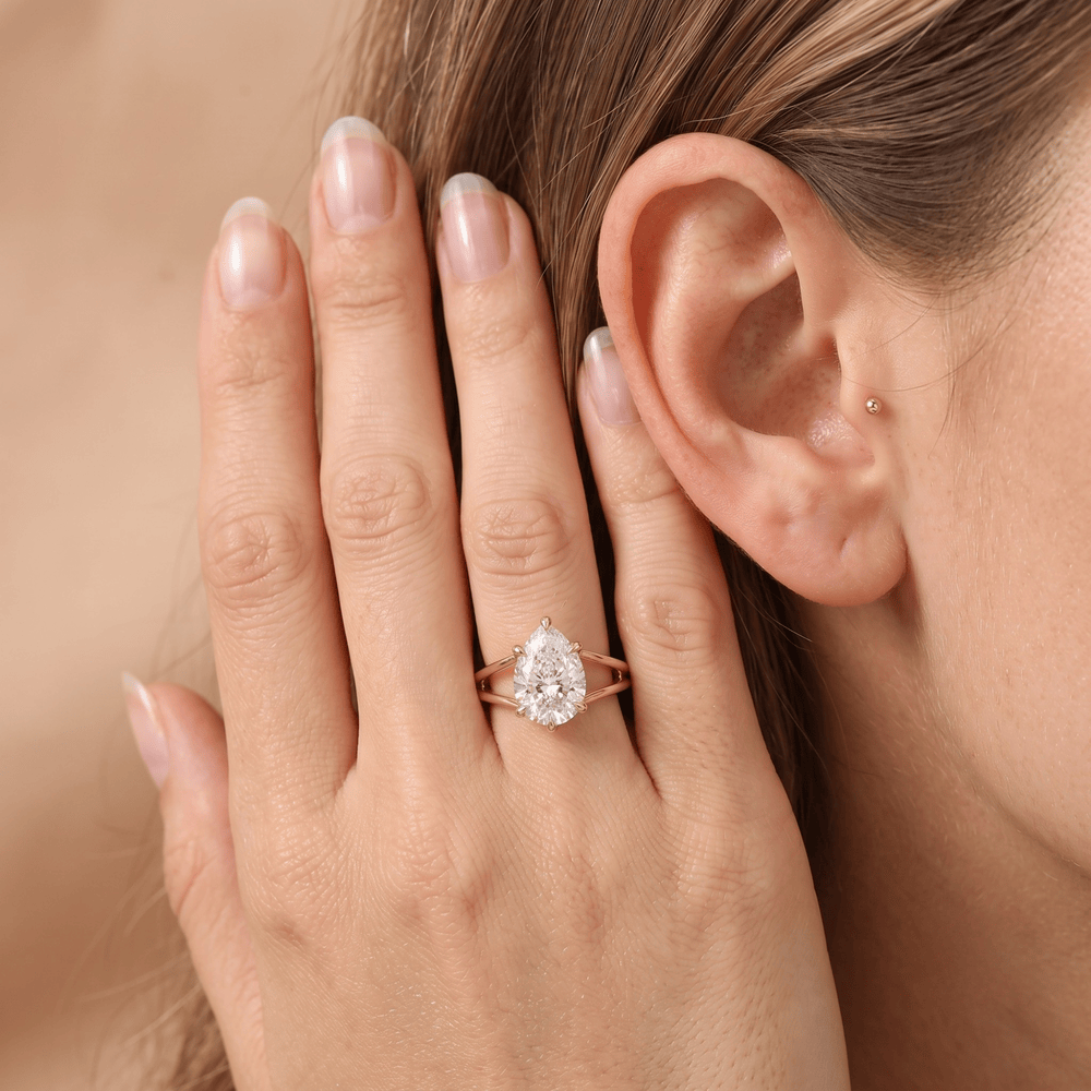 14K gold pear cut promise ring worn on hand for her
