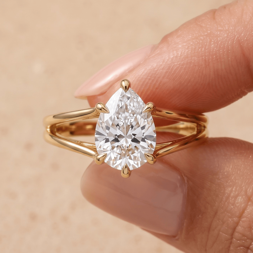 14K gold pear cut promise ring worn on hand for her