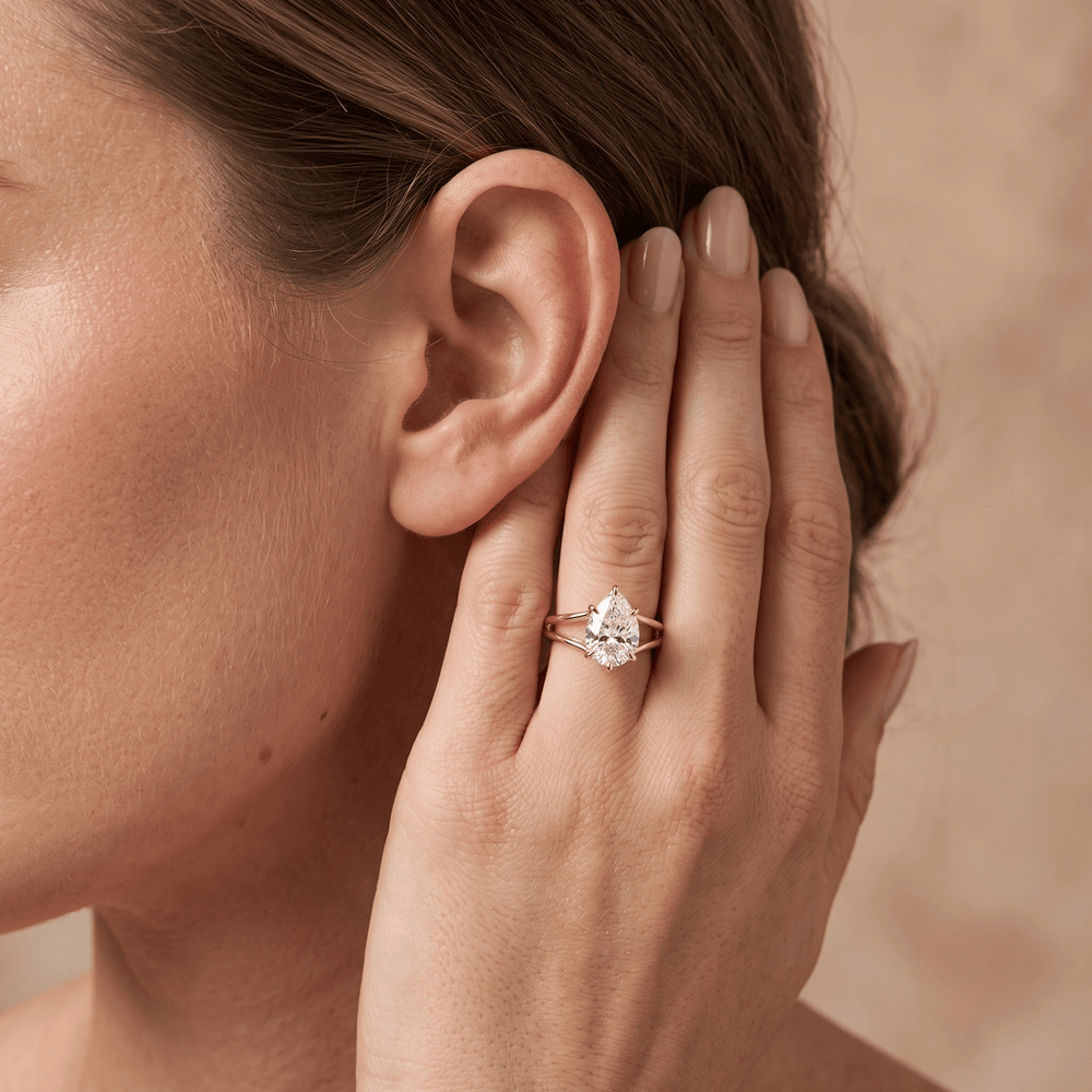 14K gold pear cut promise ring worn on hand for her