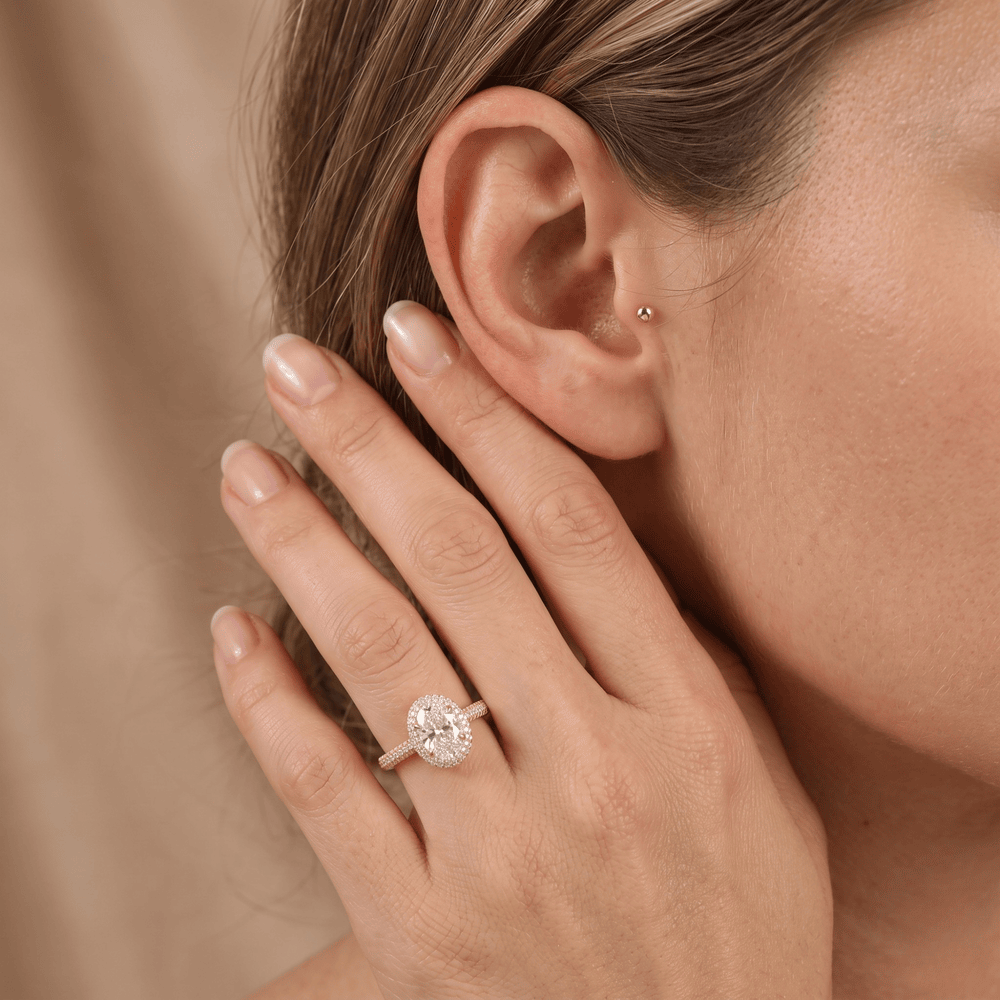 Oval halo ring lifestyle shot on hand