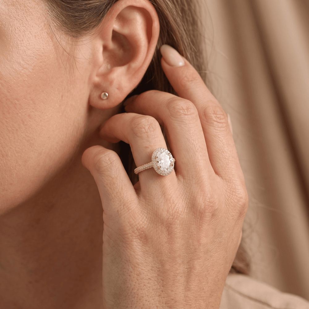 Oval halo ring lifestyle shot on hand