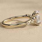 Hidden halo oval diamond engagement ring in yellow gold