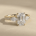 Emerald cut lab diamond engagement ring with pavé band
