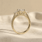 Emerald lab diamond engagement ring with sparkling side stones
