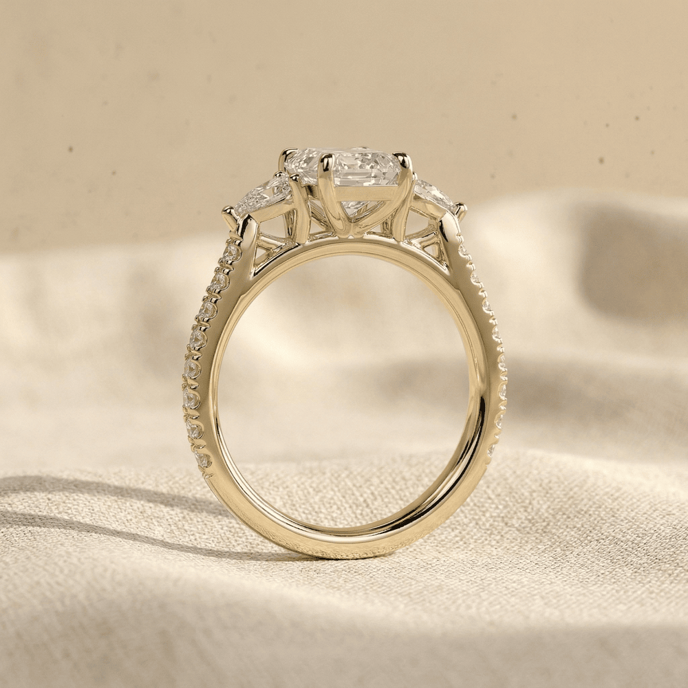 Emerald lab diamond engagement ring with sparkling side stones
