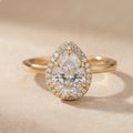 Pear shape moissanite halo ring front view