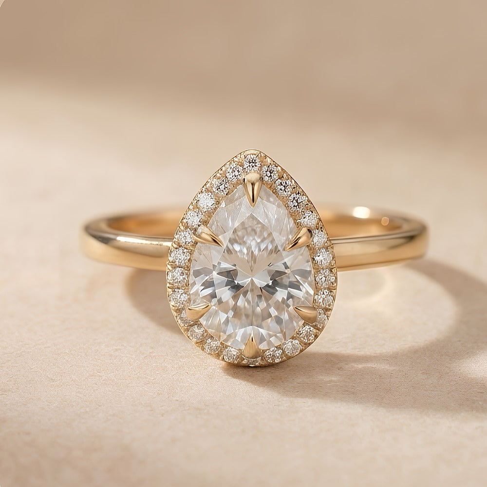 Pear shape moissanite halo ring front view