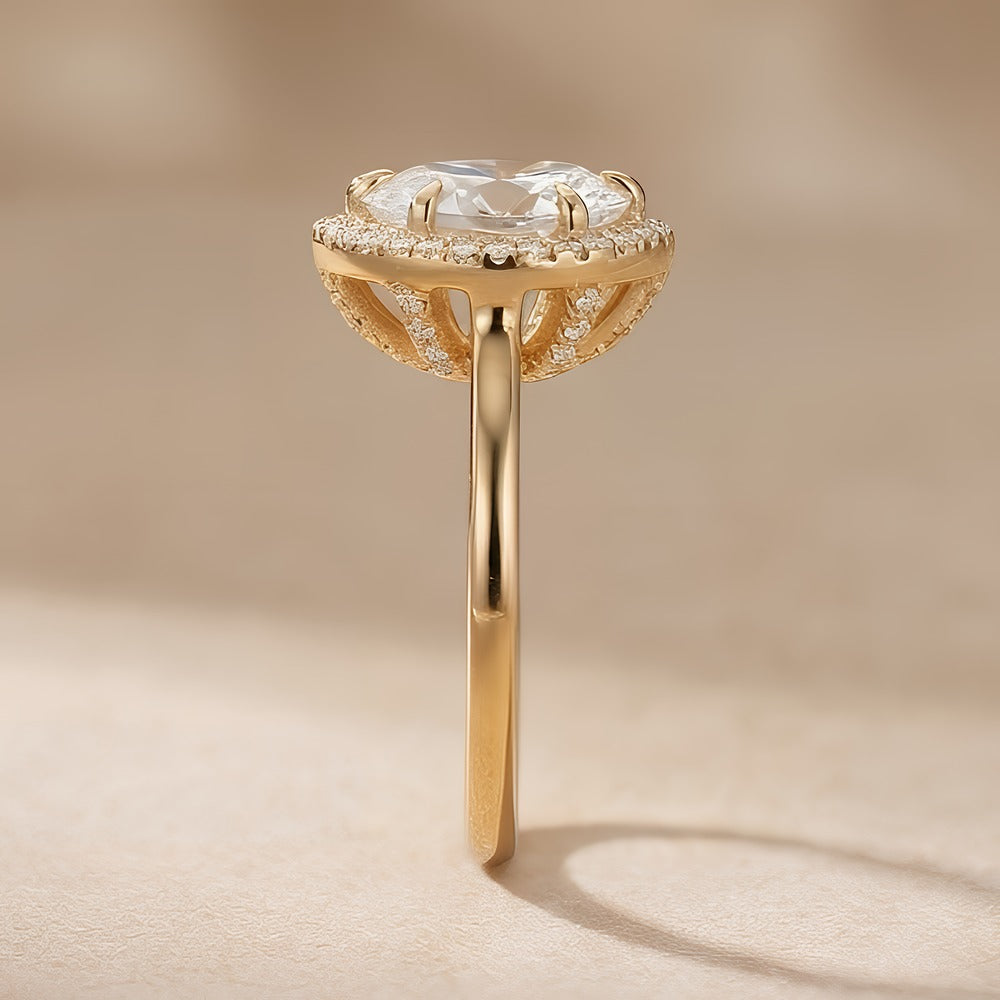 14K gold halo ring with pear moissanite side view