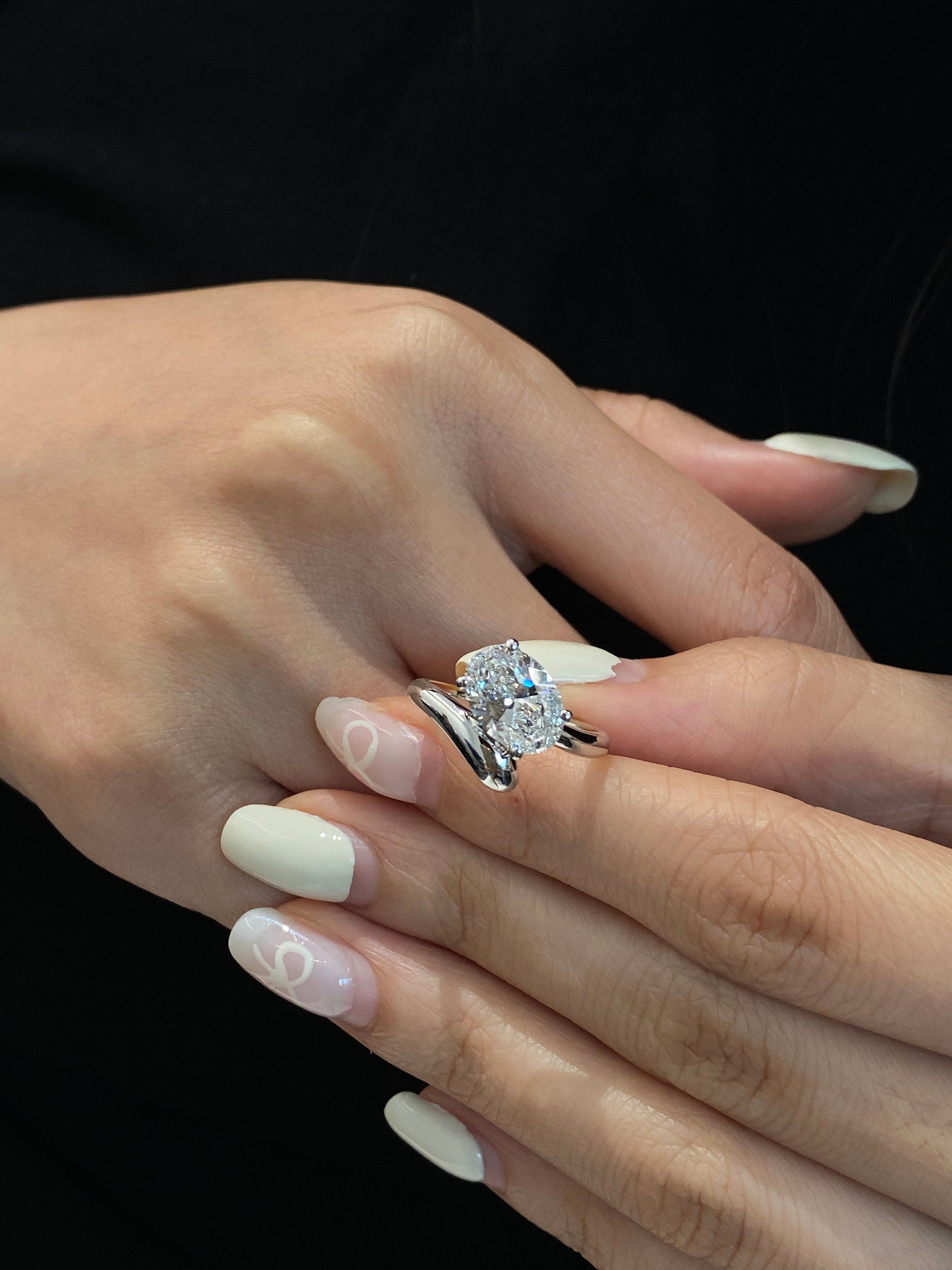 3.25 CT oval lab diamond shines in a modern setting