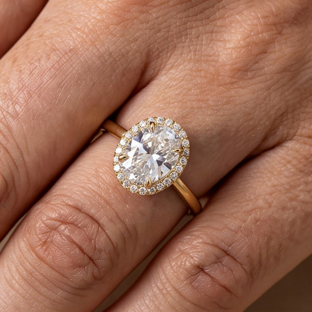 Close-up of 3CT oval diamond halo engagement ring