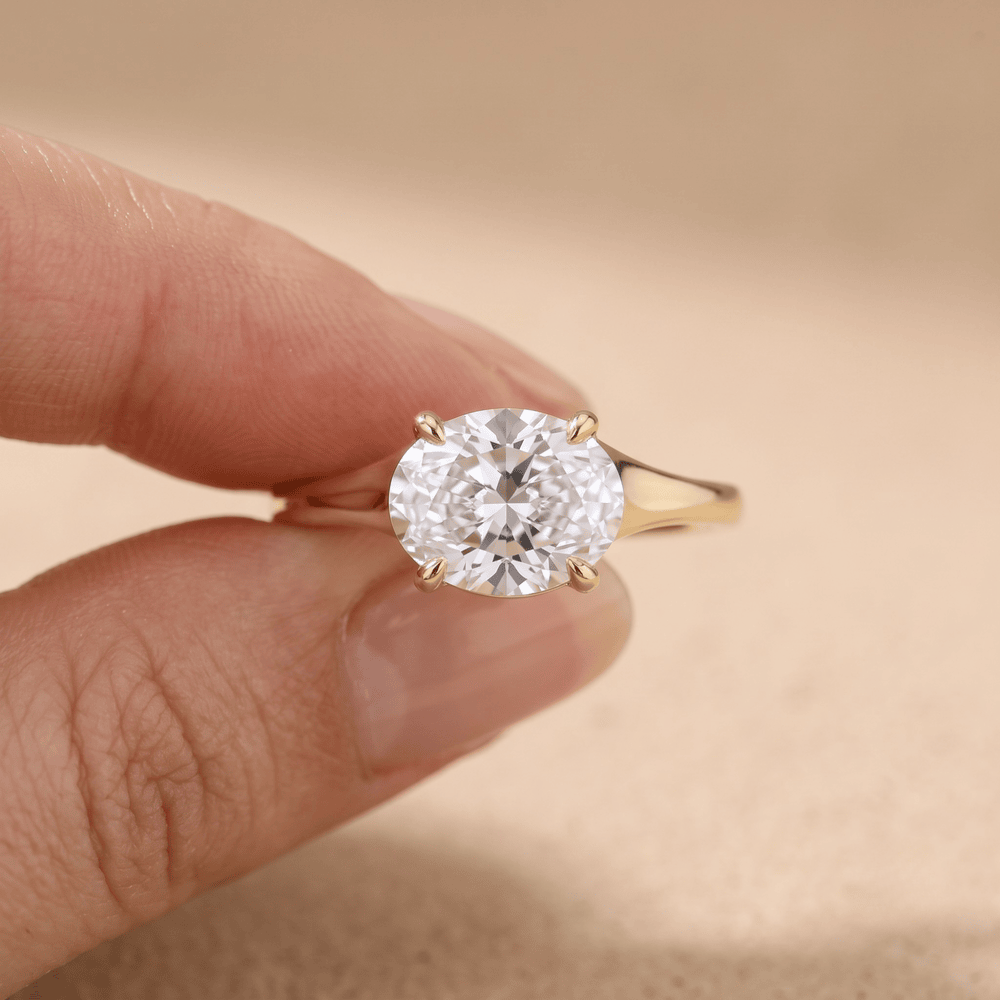 3 carat oval cut moissanite engagement ring on hand