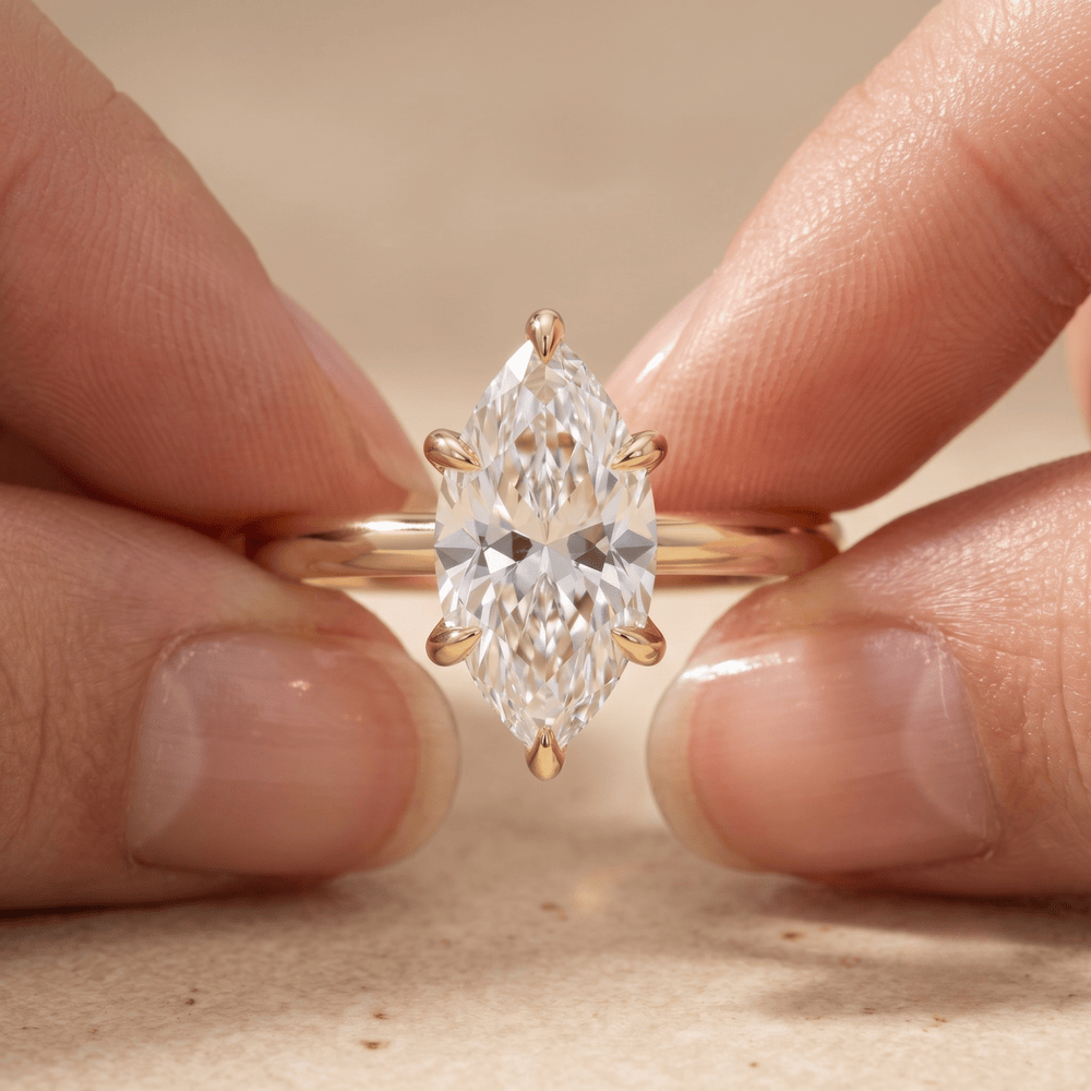 Marquise solitaire diamond ring on model hand