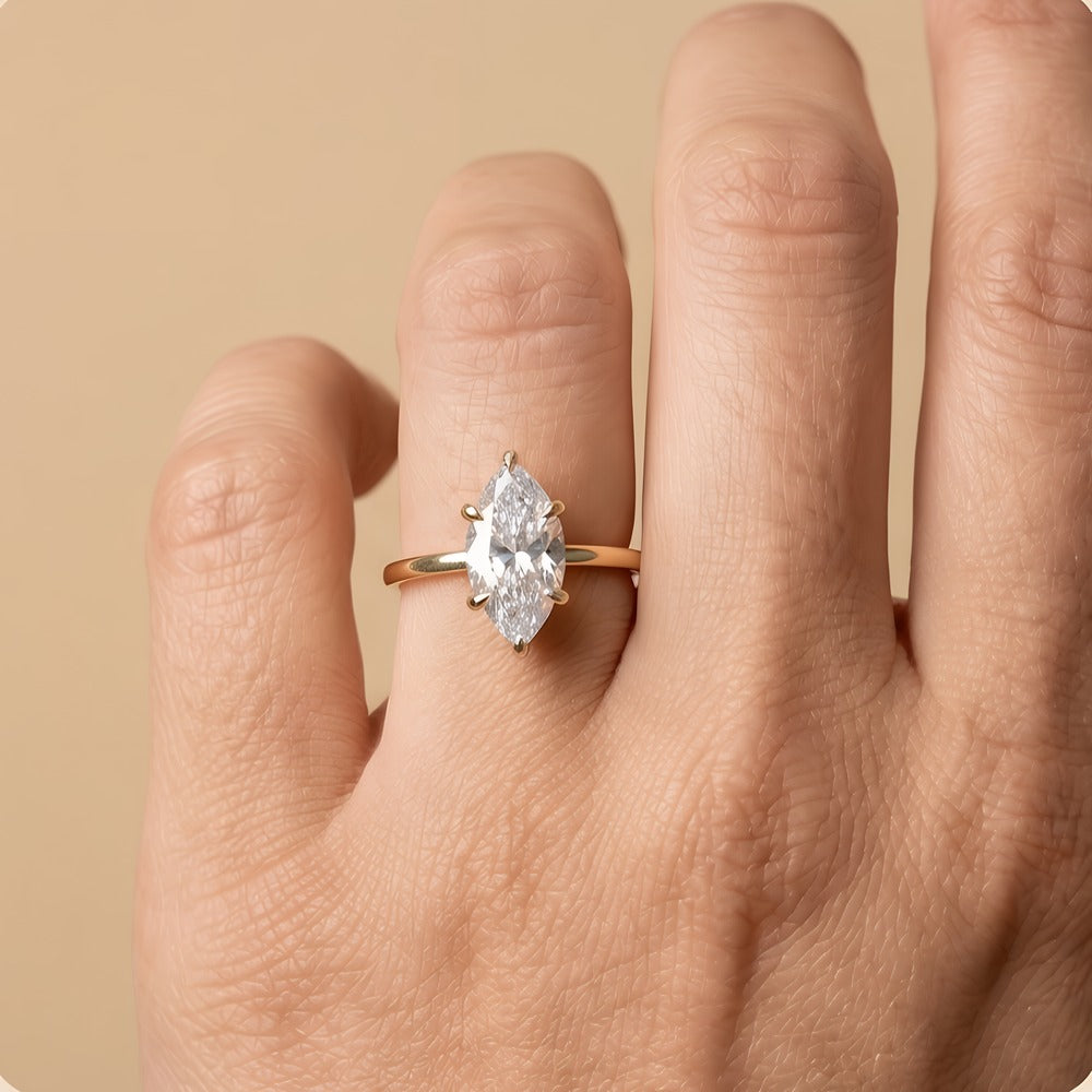 Marquise solitaire diamond ring on model hand