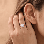 Round diamond engagement ring worn on hand