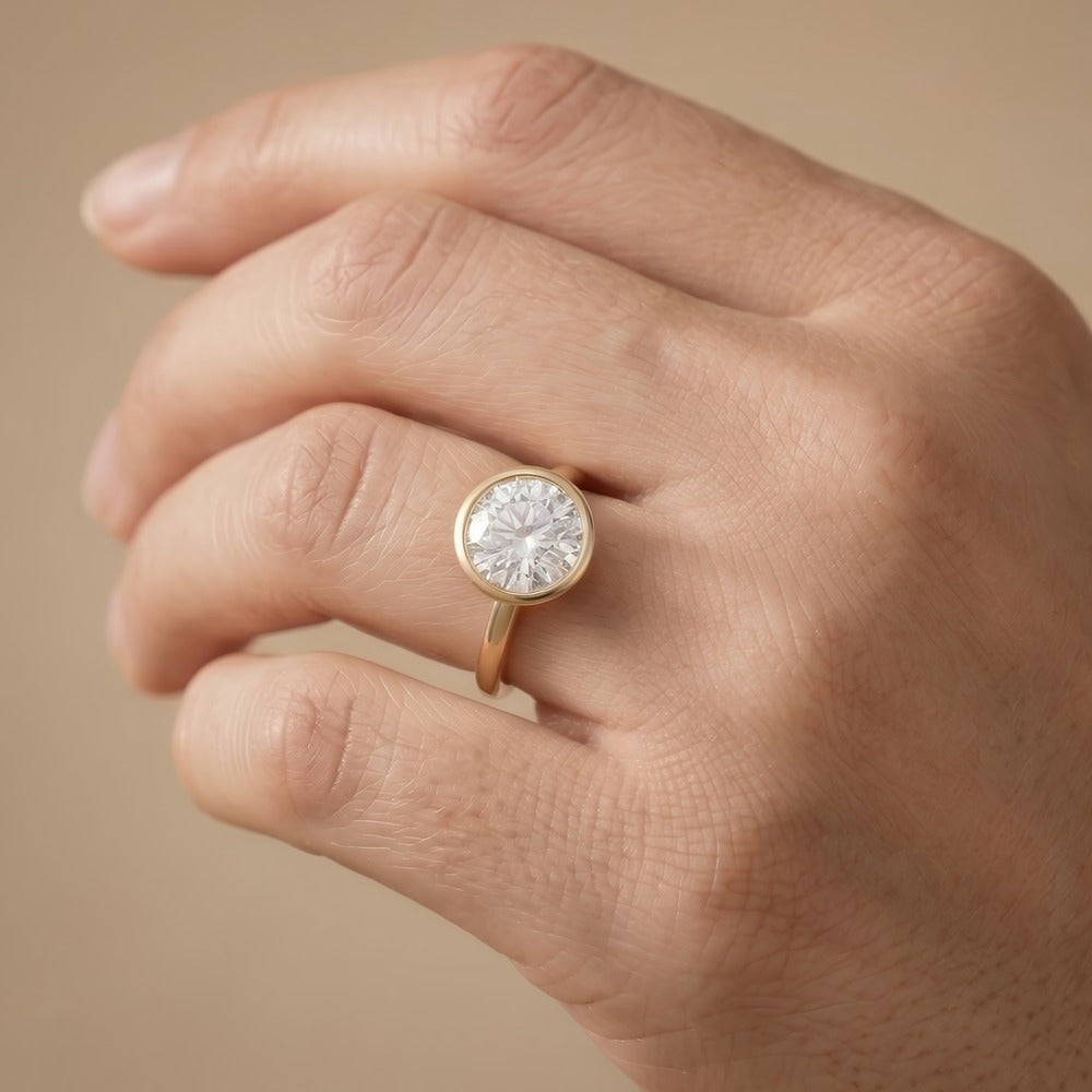 14K rose gold bezel set moissanite ring