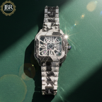 Bicolor zebra print black and white bust down watch fully iced with moissanite stones, featuring bold striped detailing across the dial and band for a striking, high-shine statement look.