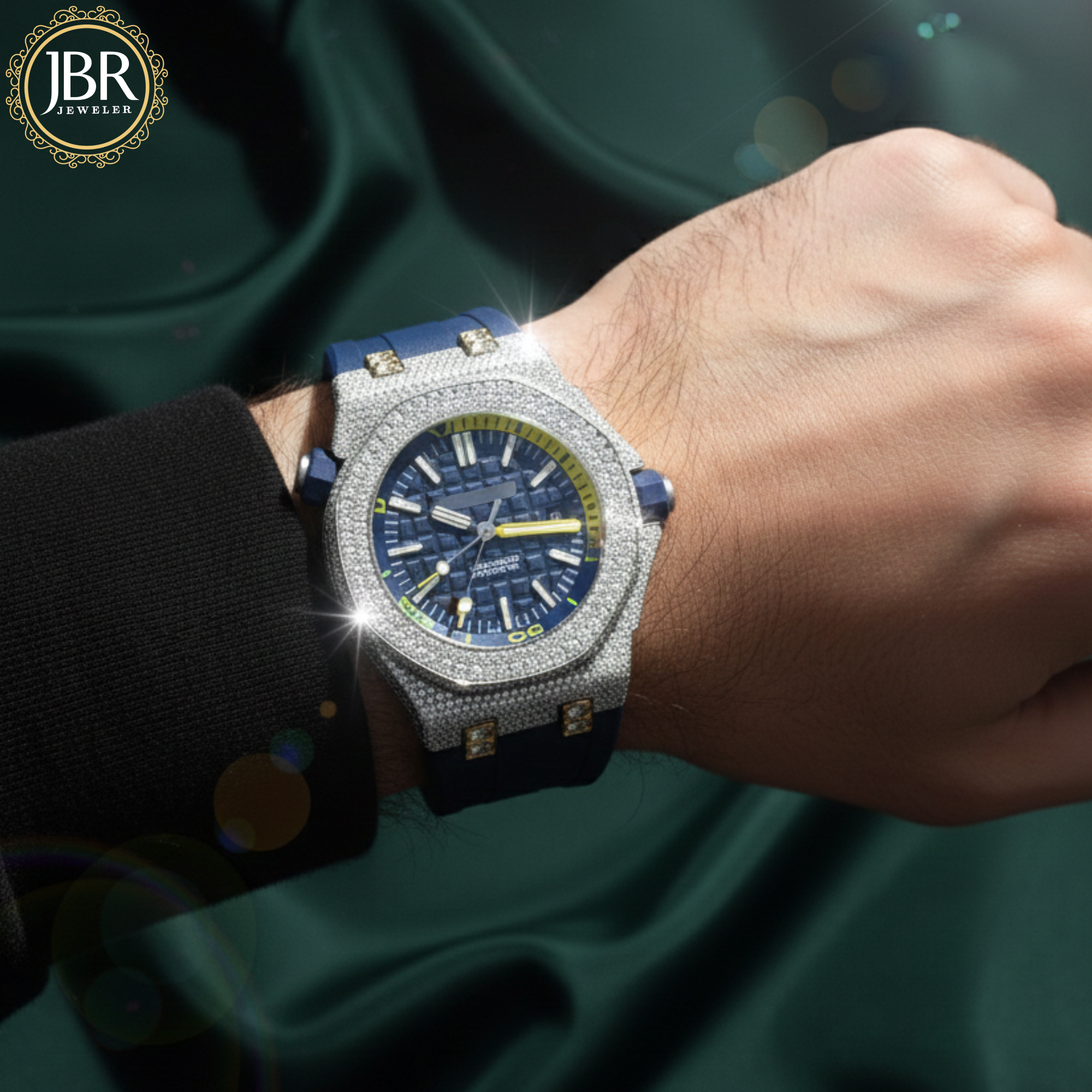 Luxury watch with blue and silver design on a wrist, brand 'JBR' visible