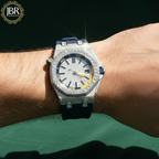 Luxury watch with diamond accents on a wrist, branded 'JBR'.
