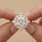Filigree halo cushion diamond ring on finger