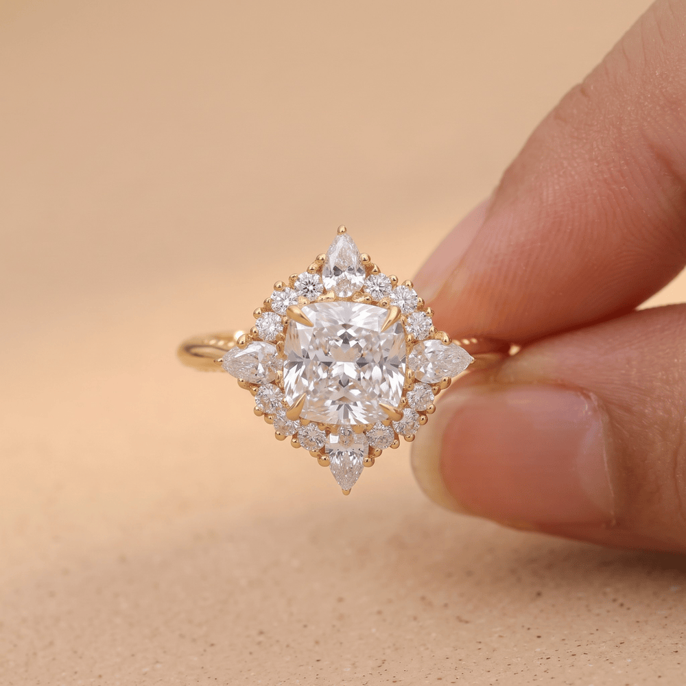Filigree halo cushion diamond ring on finger