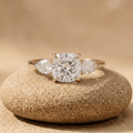 Three stone cushion diamond engagement ring in yellow gold