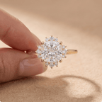 Cushion diamond ring on model's hand outdoor