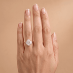 Cushion diamond ring on model's hand outdoor